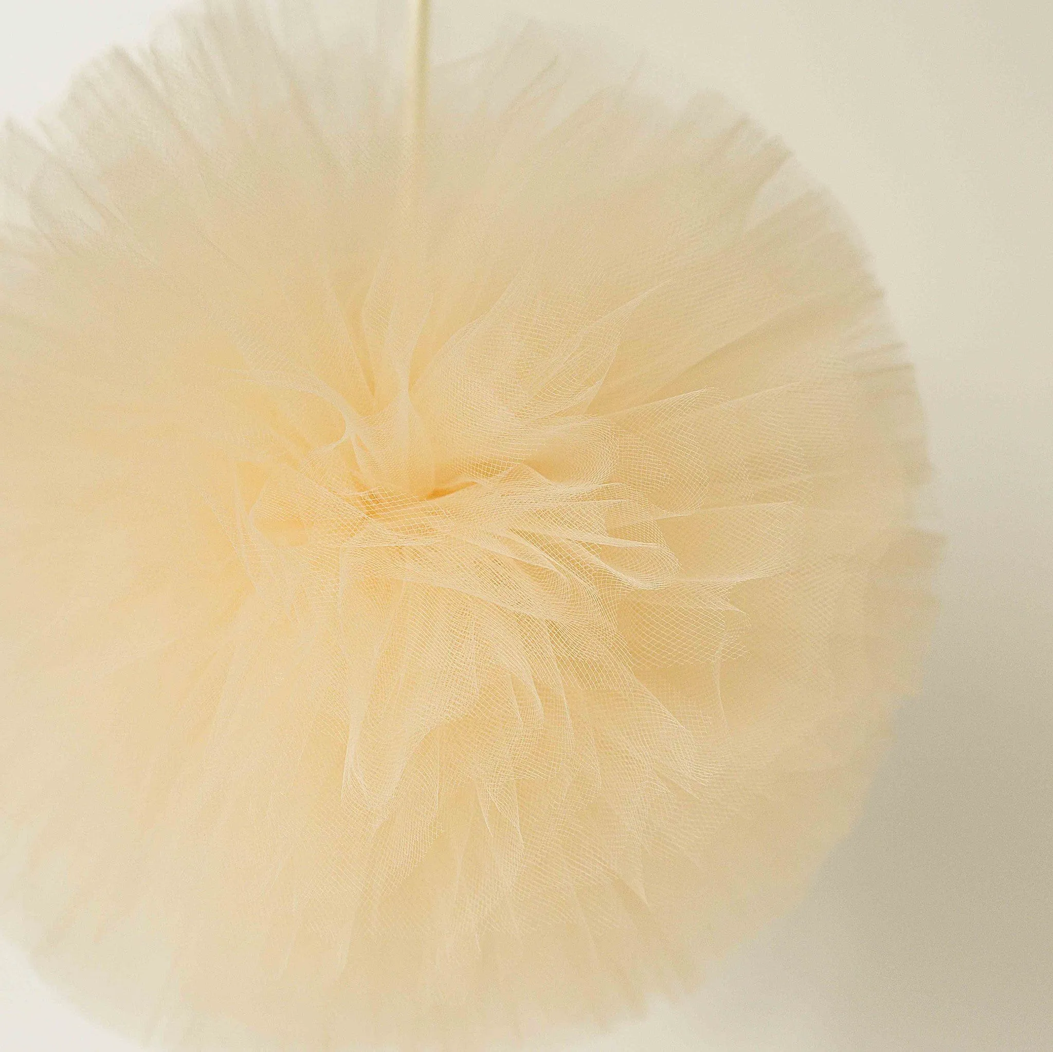 Pale peach pink tulle pom pom